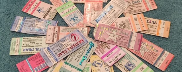 a spread of many different Grateful Dead concert ticket stubs
