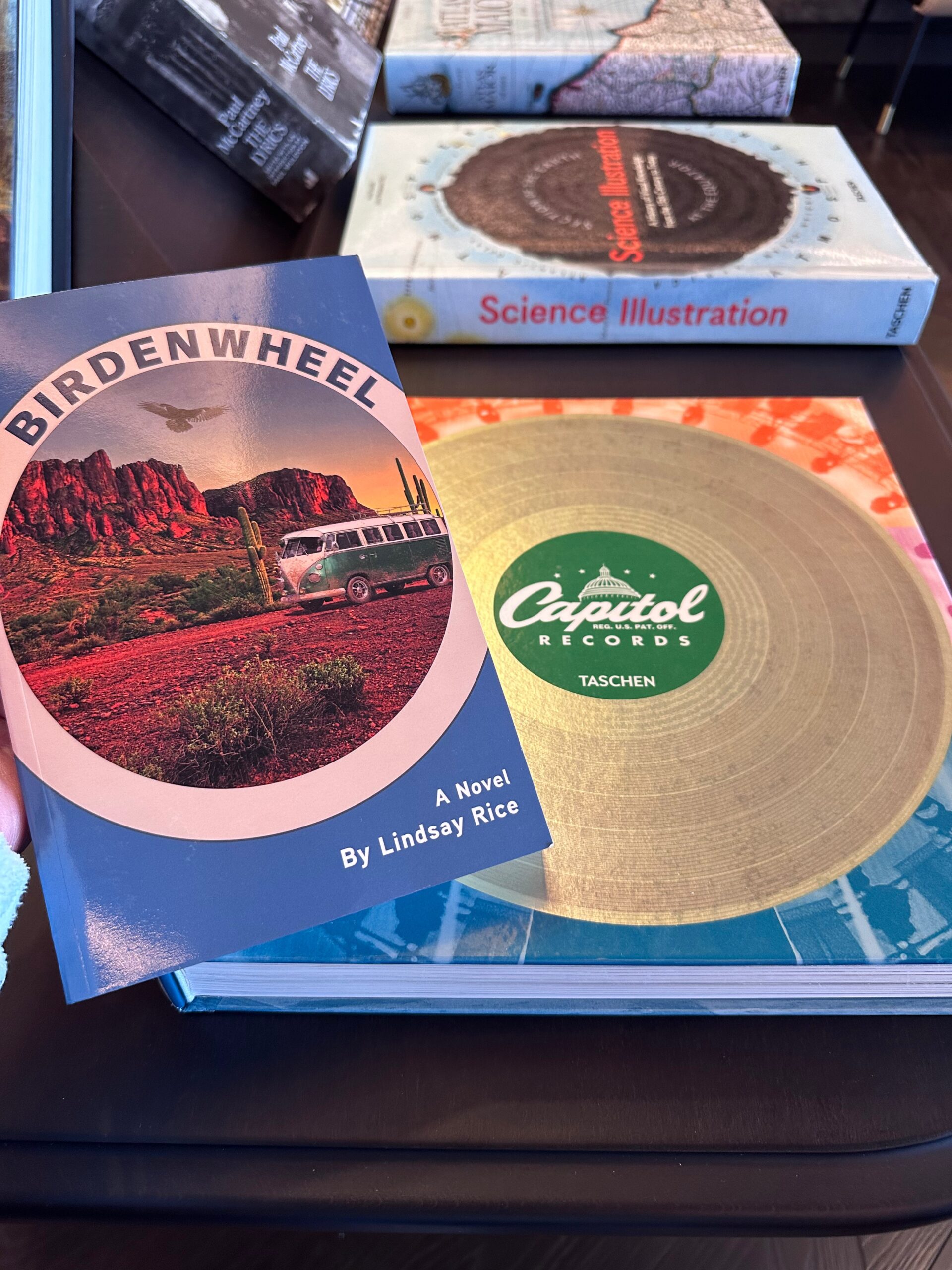 a copy of the novel "Birdenwheel" by Lindsay Rice with a book about Capitol Records and the band the Grateful Dead